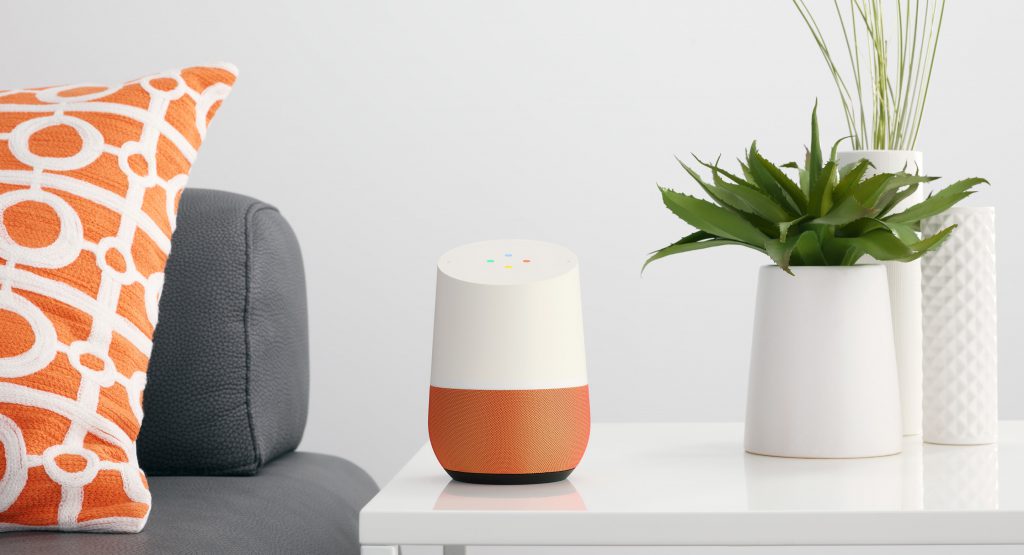 A Google Home device on a living room table.